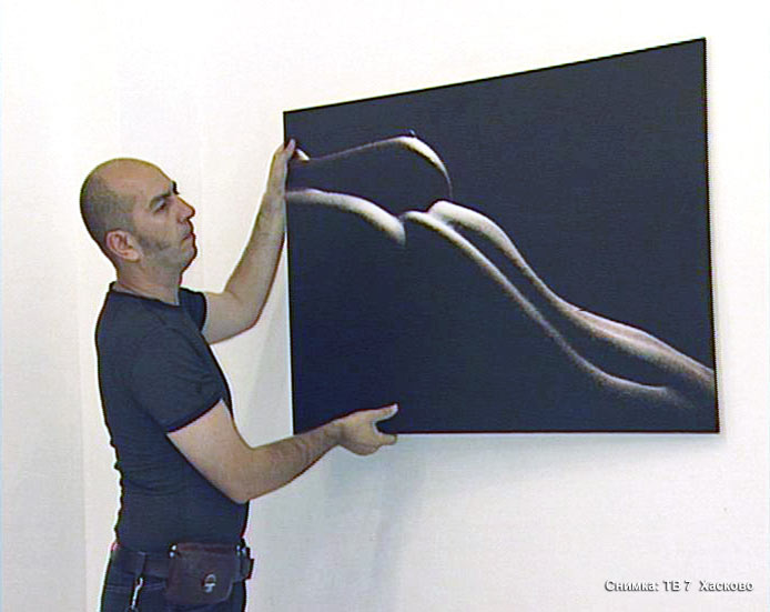 Фотографът със своя творба